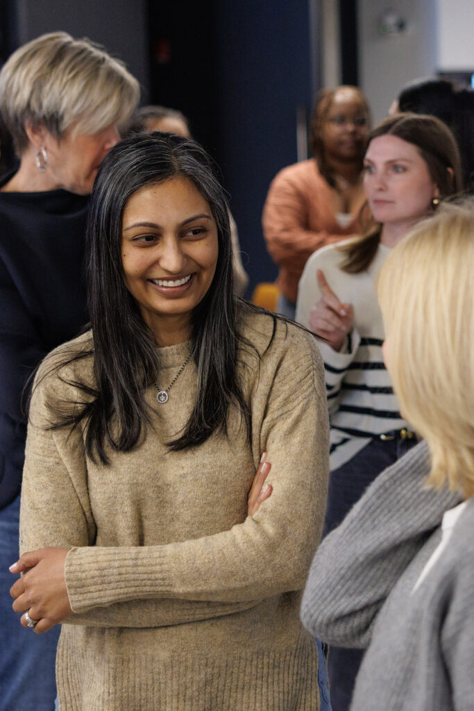 Skender team members having a conversation in the Skender office.